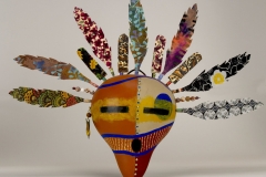 Southwestern gourd mask artwork with painted geometric patterns by Donna Vargas