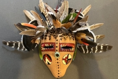 Southwestern gourd mask artwork with painted geometric patterns by Donna Vargas