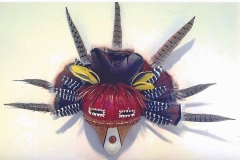 Southwestern gourd mask artwork with painted geometric patterns by Donna Vargas