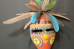 Southwestern gourd mask artwork with painted geometric patterns by Donna Vargas